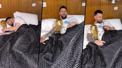 Sleeping with the beauty! Fans go berserk after Messi cuddles up with Argentina's World Cup 2022 trophy