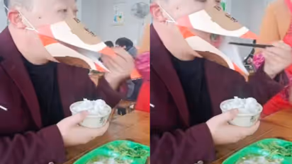 പക്ഷിയുടെ ചുണ്ടിന്റെ രൂപത്തിലുള്ള മാസ്ക് ധരിച്ച് ഭക്ഷണം കഴിക്കുന്ന യുവാവ്; വൈറലായി വീഡിയോ