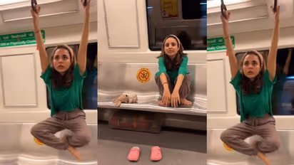 ಮೆಟ್ರೋದಲ್ಲಿ ಯುವತಿಯ ಕಸರತ್ತು:  ಹ್ಯಾಂಡ್ರೈಲ್ಸ್ ಹಿಡ್ದು ನೇತಾಡಿದ ಹುಡುಗಿ