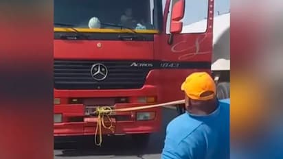 പല്ലുകള്‍ കൊണ്ട് ട്രക്ക് വലിക്കുന്ന യുവാവ്; വൈറലായി വീഡിയോ