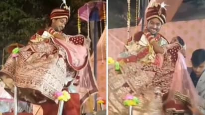 വധുവിനെ കൈകളിലെടുത്ത് ഇറങ്ങുന്നതിനിടെ വീണു; വീഴ്ചയിലും വരന്റെ 'സൂപ്പര്' പ്രതികരണം