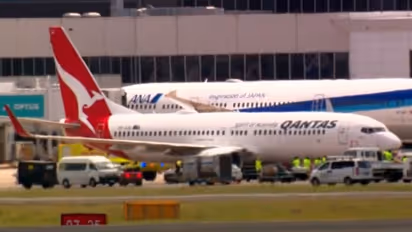 Qantas flight QF144 lands in Sydney after mayday call about engine failure