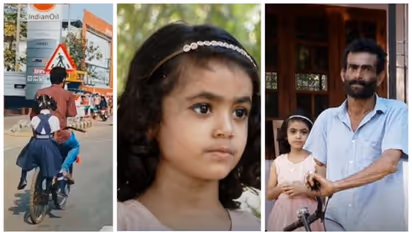 ഒറ്റക്കൈയ്യിൽ സൈക്കിളോടിച്ച് അച്ഛൻ, ചിരിച്ചുല്ലസിച്ച് പിന്നില് യുകെജിക്കാരി; ആ വൈറൽ യാത്രക്കാർ ഇവിടെയുണ്ട്...
