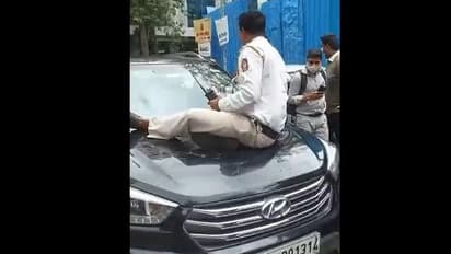 சிக்னலில் நிற்காத கார்... தடுக்க முயன்றபோது 1.5 கி.மீ. இழுத்தச் செல்லப்பட்ட போலீஸ்