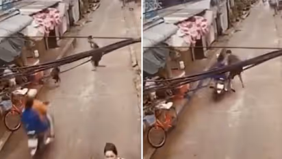 Watch: Man's lightning reflex saves toddler from being hit by bike; netizens showers praises