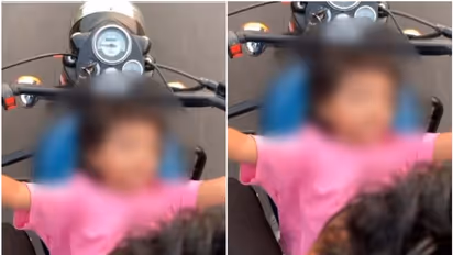 ചീറി പായുന്ന ബുള്ളറ്റിന്‍റെ ടാങ്കിൽ കുഞ്ഞിനെ കിടത്തി യാത്ര! വീഡിയോയുമായി പൊലീസ്; 'സ്നേഹമല്ല, അപകടകരമായ കുറ്റം'