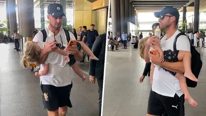 IPL 2023: Day after RCB's win over MI, AB de Villiers spotted doing daddy duty at Mumbai airport - WATCH