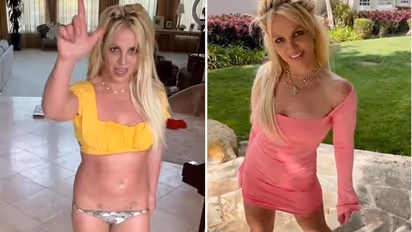 Distressed Britney Spears walks out of hotel topless, holds pillow after fight with beau Paul Richard Soliz