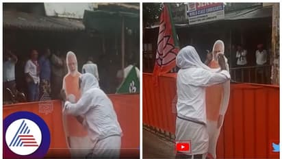 ಮಳೆಯ ನಡುವೆಯೇ ಪ್ರಧಾನಿಯ ಕಟೌಟ್‌ ಒರೆಸುತ್ತಾ ನಿಂತ ಅಭಿಮಾನಿ, ಮೋದಿನೇ ನಮ್ಮ ದೇವರೆಂದ!