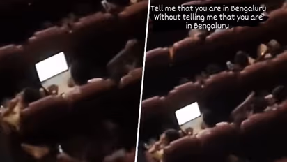 Viral video: Bengaluru man spotted working on laptop in movie theatre; netizens react