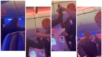 മദ്യലഹരിയില് വിമാനത്തില് ബഹളം വച്ച് യുവതി, അറസ്റ്റ് ചെയ്യാനെത്തിയ പോലീസിന് കടിയും ചവിട്ടും; വൈറല് വീഡിയോ