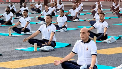 International Yoga Day 2023: Defence Minister Rajnath Singh performs Yoga onboard INS Vikrant (WATCH)