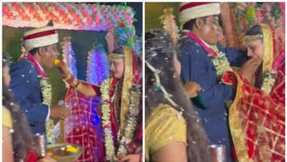 വരൻ കഴിച്ച ലഡുവിന്‍റെ മറുപാതി കഴിക്കാൻ മടിച്ച് വധു; വായിൽ തിരികി കയറ്റി വരൻ; വൈറലായി വീഡിയോ !