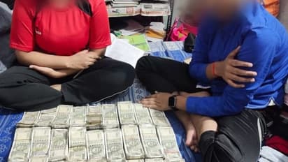 నోట్ల కట్టలతో భార్య, పిల్లలు సెల్ఫీలు.. చిక్కుల్లో పడ్డ పోలీసు అధికారి ..