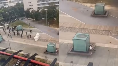 ಗುಂಡಿನ ಚಕಮಕಿ ಪಕ್ಕದಲ್ಲೇ ಸ್ಯಾಂಡ್ವಿಚ್ ತಿನ್ನುತ್ತಾ ಕುಳಿತ ವ್ಯಕ್ತಿ, ಇದು ಹಸಿವೋ, ಭಂಡ ಧೈರ್ಯವೋ?