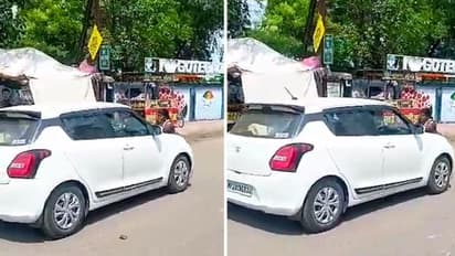 Madhya Pradesh woman jumps on to police car's bonnet to stop son's arrest; dragged till station | WATCH