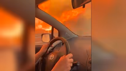Wildfires ravage Italy: Terrifying video of woman's attempt to flee blaze in Sicily goes viral (WATCH)