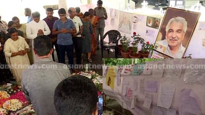 പരാതികളും പ്രാർത്ഥനകളുമായി ഉമ്മൻചാണ്ടിയെ കാണാൻ ജനപ്രവാഹം; കല്ലറയ്ക്ക് മുന്നിൽ നിവേദനങ്ങൾ നിറയുന്നു