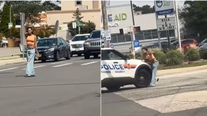 WATCH: US woman pointing gun at traffic struck by police car; disturbing video goes viral