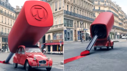 Beauty brand gets creative! Giant-size lipstick paints the town red, literally - WATCH
