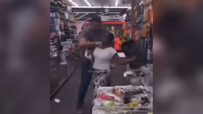 Shocking! London shopkeeper grabs woman by throat after altercation; controversial video goes viral - WATCH