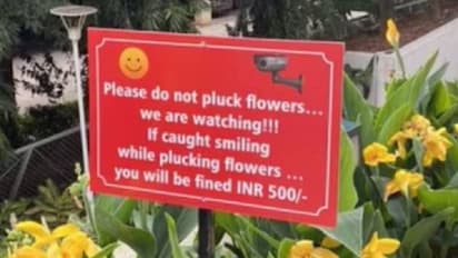 പൂക്കൾ പറിക്കുമ്പോൾ ചിരിച്ചാൽ 500 രൂപ പിഴ, വൈറലായി ബംഗളൂരുവിലെ ബോർഡ്!