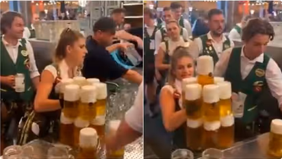WATCH: Oktoberfest Waitress carries 13 beer mugs at a time; leaves internet impressed