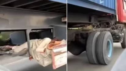 അതിവേഗതയിൽ ഓടുന്ന ട്രക്കിനടിയിൽ സുഖമായി കിടന്നുറങ്ങുന്ന മനുഷ്യൻ; ആരേയും ഭയപ്പെടുത്തും ഈ വീഡിയോ