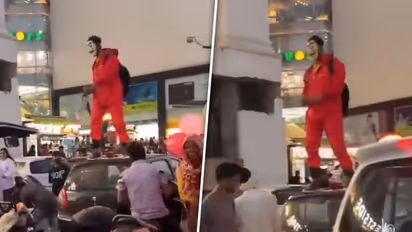 Viral video: Jaipur man dressed in 'Money Heist' costume showers money in air