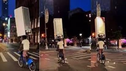 யப்பா இது தலையா இல்ல வேற.. தலையில் ஃப்ரிட்ஜை வைத்து சைக்கிள் ஓட்டும் இளைஞர்.. வீடியோ வைரல்..!!