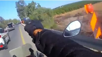 Dramatic! Israeli cop fires gun from moving bike in shootout with Hamas operatives amid war - WATCH