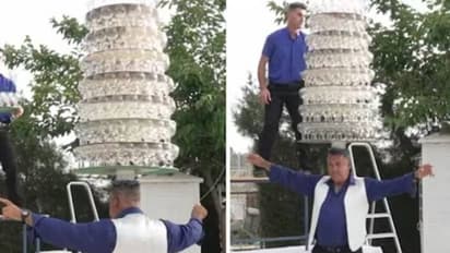 തലയിൽ 319 വൈൻ​ഗ്ലാസുകൾ, ചുവടുകളുമായി റെക്കോർഡ് നേടി 62 -കാരൻ!