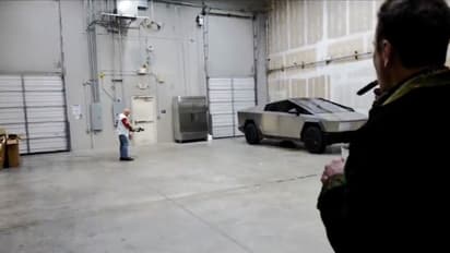 WATCH: Elon Musk enjoys cigar as Joe Rogan tests Tesla Cybertruck's resilience with an arrow