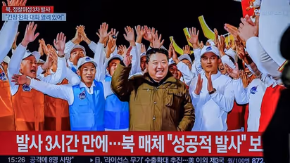 North Korea's spy satellite launch celebration: Kim Jong Un's daughter, scientists don matching t-shirts