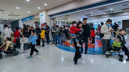 China faces pneumonia surge, officials dismiss new infectious disease