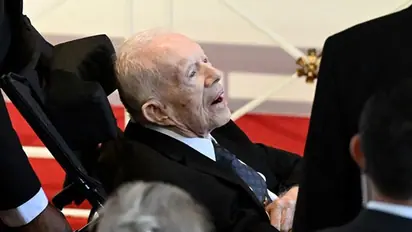 Former US President Jimmy Carter makes rare appearance at wife Rosalynn's memorial