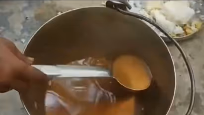 Viral Video: Outrage after students served boiled dal water, forced to carry LPG cylinders in UP school
