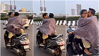 'സ്കൂട്ടറില് സഞ്ചരിക്കുന്നതിനിടെ ചുംബനം': നടപടി വേണമെന്ന് എംവിഡിയോട് സോഷ്യൽമീഡിയ, വീഡിയോ