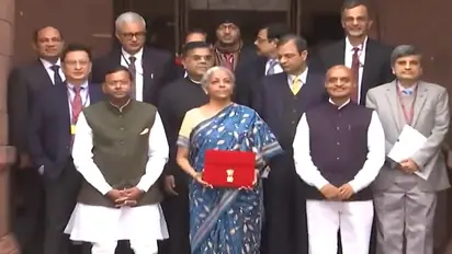 Interim Budget 2024: FM Nirmala Sitharaman dons blue saree, poses with red tablet