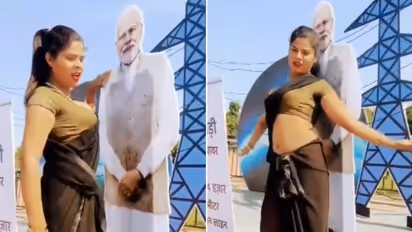 SHOCKING! Woman hugs, performs explicit dance moves with PM Modi's cutout at selfie point (WATCH)