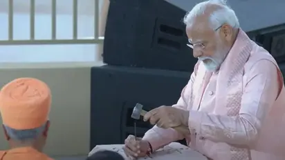 PM Modi inscribes 'Vasudhaiv Kutumbakam' on stone using hammer, chisel at BAPS Mandir