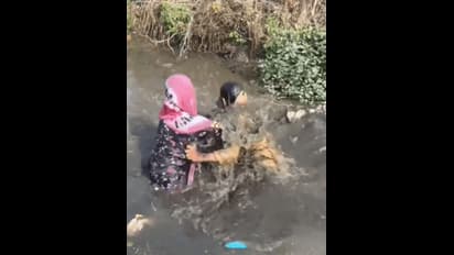 Viral Video: Couple’s shocking street altercation ends in a drain (WATCH)