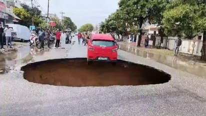SHOCKING! Road collapses in UP's Lucknow, nearly traps car in deep pit; WATCH viral video