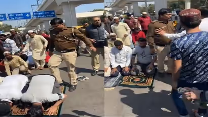 Viral Video! Delhi Police Cop was seen hitting and kicking people offering Namaz at road [WATCH]
