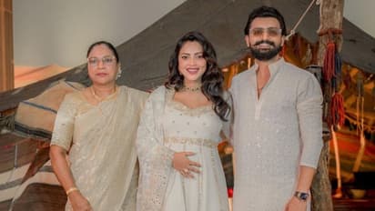 'Aadujeevitham': Amala Paul stuns in elegant white dress, flaunts baby bump at film's music launch