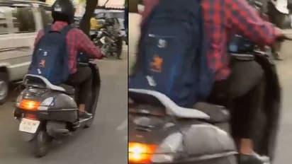 സ്കൂട്ടറോടിക്കുന്ന യുവാവിന്റെ മടിയിൽ തുറന്നുവച്ച ലാപ്ടോപ്പിൽ സൂം മീറ്റിം​ഗ്, വീഡിയോ കണ്ടമ്പരന്ന് നെറ്റിസൺസ്