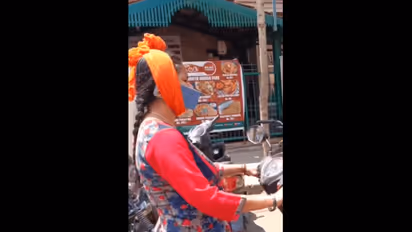 Viral Video: Bengaluru woman's phone 'jugaad' on scooter sparks safety concerns (WATCH)