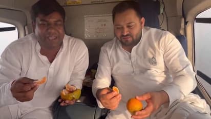 'Orange ke rang se': After 'fish' row, RJD leader Tejashwi Yadav takes dig at BJP while eating oranges (WATCH)