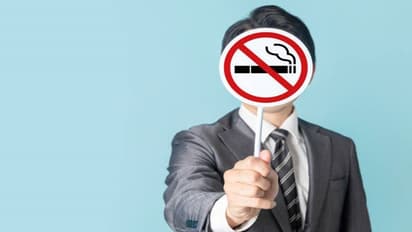 What is the UK smoking ban, how will it be implemented, and when will it go into effect?