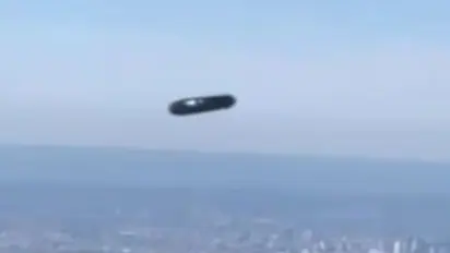 UFO spotted over New York City? Mysterious 'flying cylinder' gliding high in skies sparks speculation (WATCH)